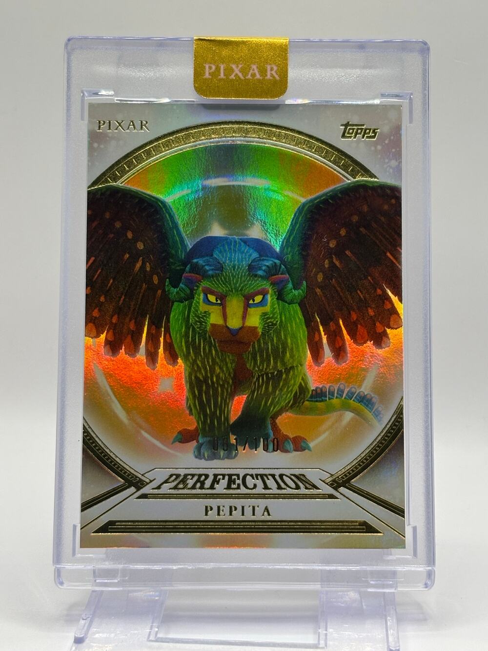 2025 Topps Disney Pixar Pepita Encased Gold Perfection Refractor 81/100 SP Coco